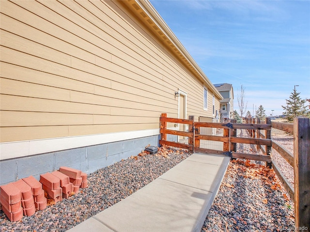 view of property exterior with fence