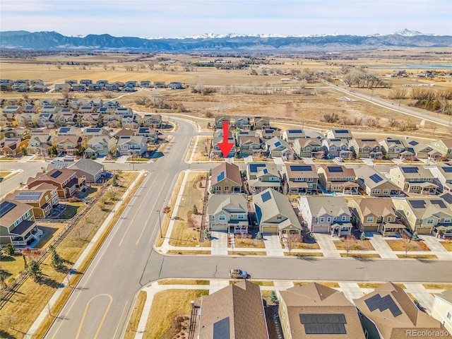 drone / aerial view with a residential view and a mountain view