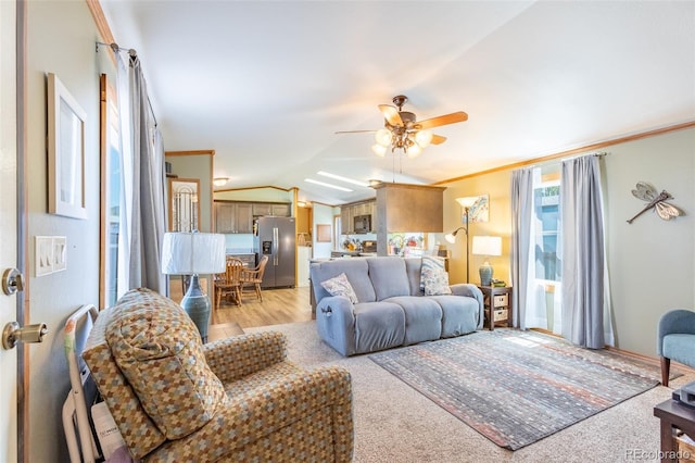 910 J St Unit D1, Salida, CO 81201 - living area featuring a ceiling fan, crown molding, lofted ceiling, and light wood-style floors