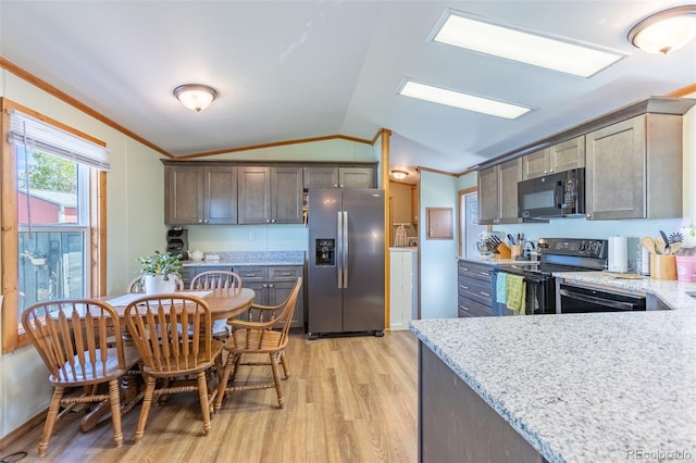 910 J St Unit D1, Salida, CO 81201 - kitchen with black appliances, vaulted ceiling, crown molding, light wood-style floors, and light stone countertops