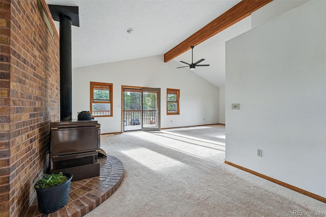 2100 Bibles Hill Dr, Franktown, CO 80116 - living area with a wood stove, carpet flooring, baseboards, and a ceiling fan