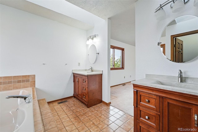 2100 Bibles Hill Dr, Franktown, CO 80116 - full bathroom with two vanities, baseboards, a bath, and tile patterned floors
