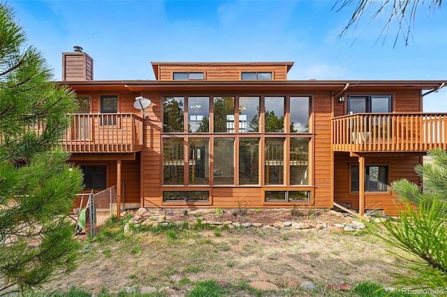 2100 Bibles Hill Dr, Franktown, CO 80116 - back of property featuring a chimney and fence