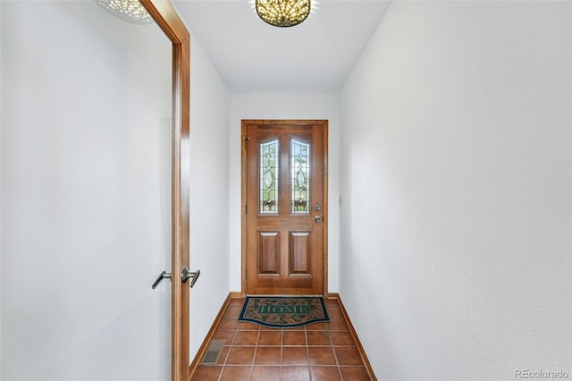 2100 Bibles Hill Dr, Franktown, CO 80116 - doorway to outside featuring baseboards and tile patterned flooring
