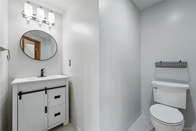 2100 Bibles Hill Dr, Franktown, CO 80116 - half bathroom featuring baseboards, vanity, and toilet