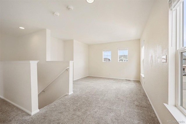 spare room with recessed lighting, carpet flooring, and baseboards