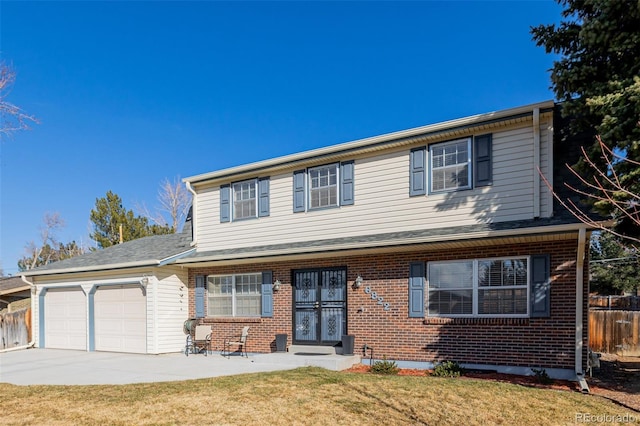 front of property featuring a garage and a front lawn