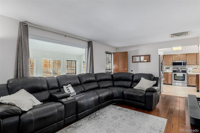 living room featuring dark hardwood / wood-style floors