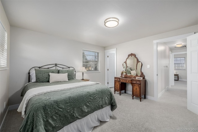 bedroom with light colored carpet