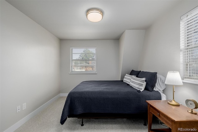 bedroom featuring light carpet