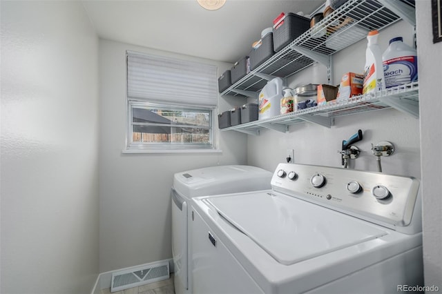 washroom with washer and clothes dryer