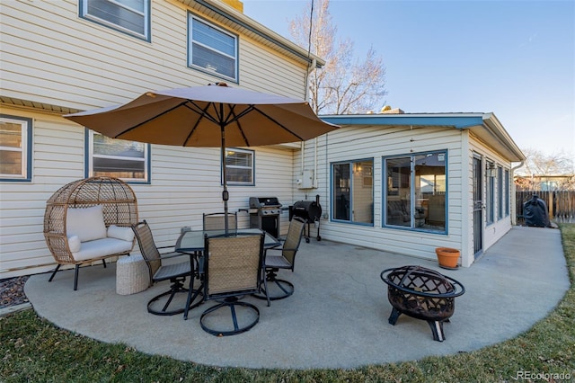 view of patio with a grill and a fire pit