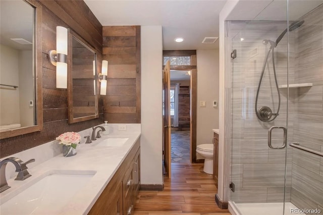 13 Paradise Rd, Crested Butte, CO 81225 - full bath with wood finished floors, double vanity, a shower stall, and recessed lighting