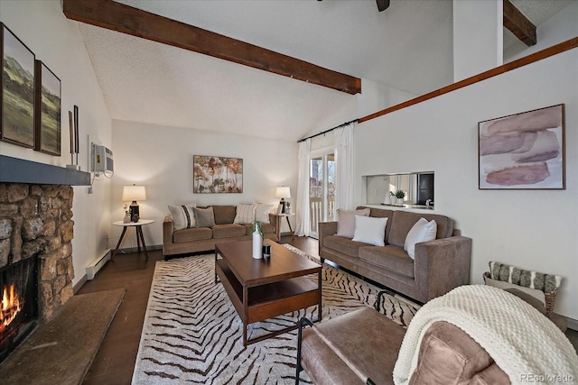 living area featuring wood finished floors, vaulted ceiling with beams, a textured ceiling, a fireplace, and a baseboard heating unit