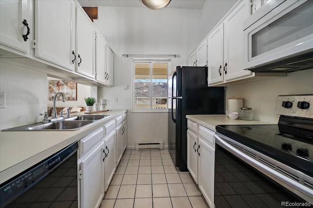 kitchen with light countertops, baseboard heating, white cabinets, a sink, and black appliances