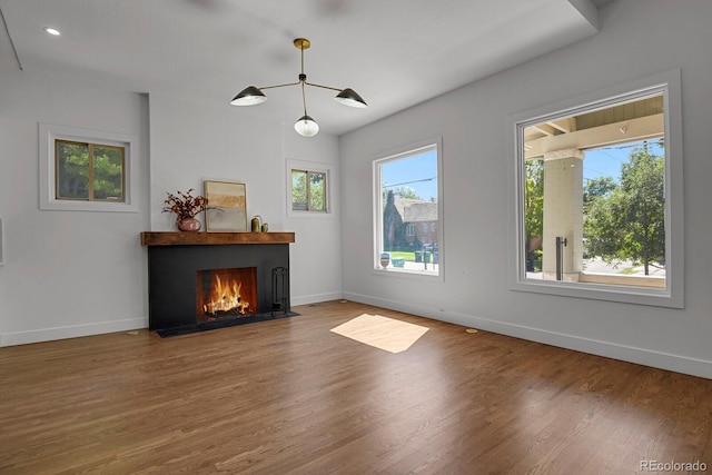 unfurnished living room featuring hardwood / wood-style flooring