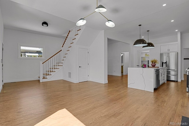 living room with light hardwood / wood-style floors