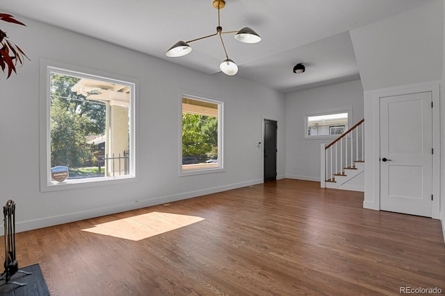 interior space with dark hardwood / wood-style floors and a chandelier