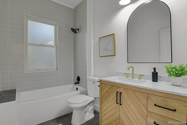 full bathroom featuring tiled shower / bath combo, vanity, and toilet