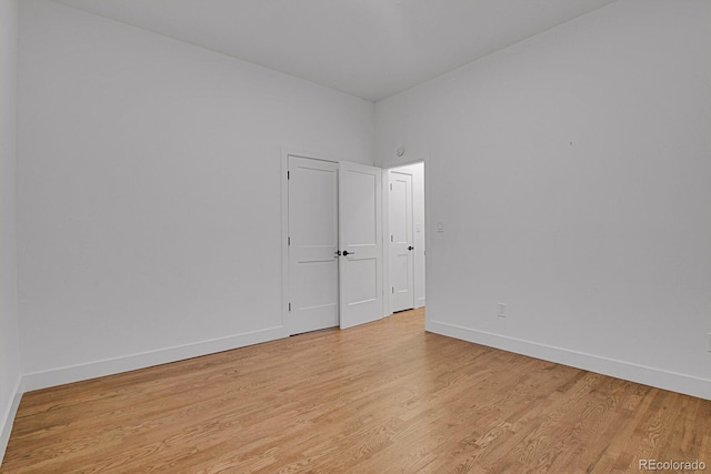 spare room featuring light wood-type flooring