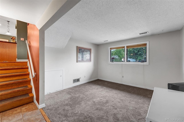1161 S Johnson Way, Lakewood, CO 80232 - empty room with a textured ceiling, stairs, and carpet