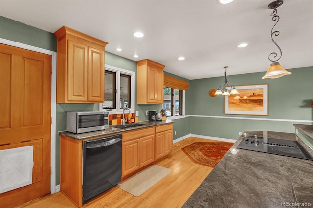 1161 S Johnson Way, Lakewood, CO 80232 - kitchen with black appliances, light wood-type flooring, pendant lighting, a chandelier, and recessed lighting