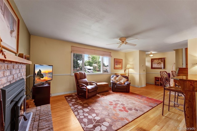 1161 S Johnson Way, Lakewood, CO 80232 - living area featuring wood finished floors and a ceiling fan