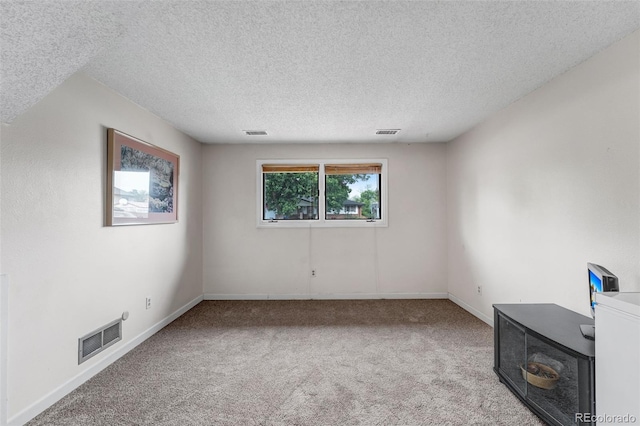 1161 S Johnson Way, Lakewood, CO 80232 - carpeted empty room featuring a textured ceiling and baseboards