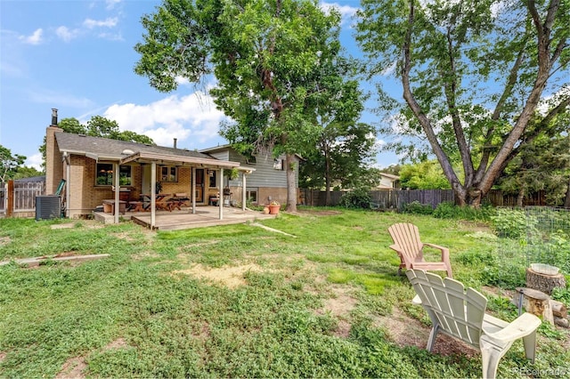1161 S Johnson Way, Lakewood, CO 80232 - fenced backyard featuring a patio