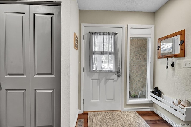 1711 Cato Cir Unit 21, Lafayette, CO 80026 - entryway with dark wood-type flooring