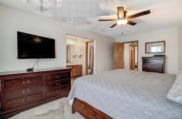 bedroom featuring ensuite bathroom and ceiling fan