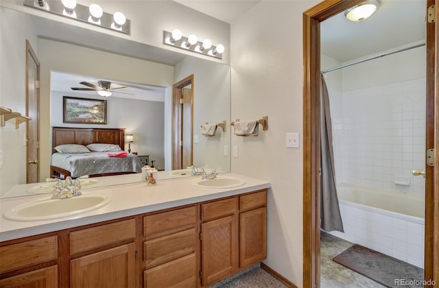 bathroom with ceiling fan, vanity, and shower / bath combo