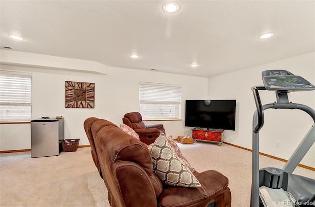 carpeted living room featuring a healthy amount of sunlight