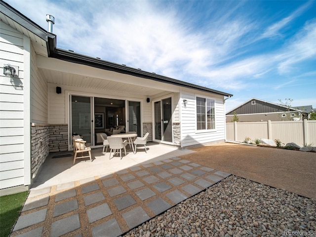 back of property featuring a patio area