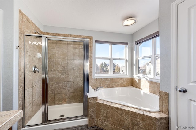 bathroom with shower with separate bathtub