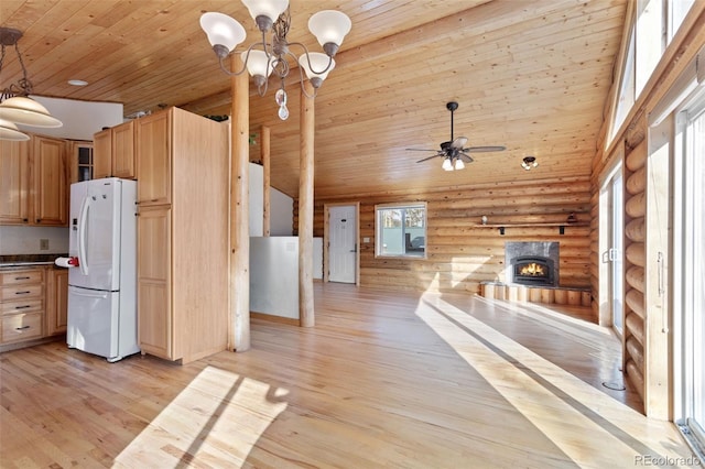 kitchen with log walls, wooden ceiling, white fridge with ice dispenser, high vaulted ceiling, and light hardwood / wood-style floors