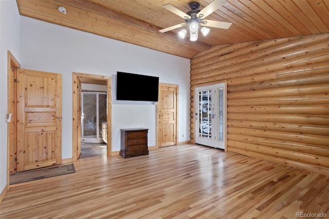 unfurnished living room with light hardwood / wood-style flooring, rustic walls, lofted ceiling, and wood ceiling