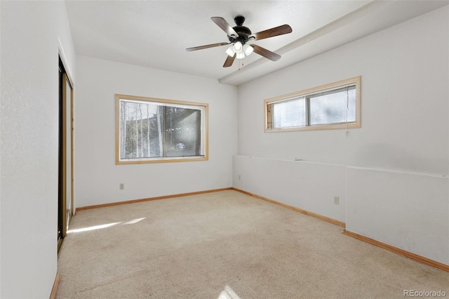 unfurnished bedroom with a closet, ceiling fan, and light carpet