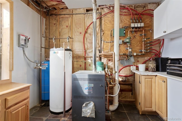 utility room featuring gas water heater