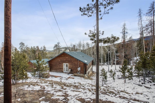 view of snowy exterior featuring a mountain view