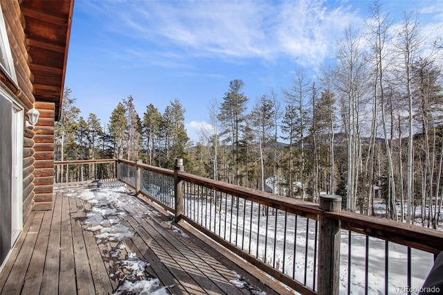 view of snow covered deck