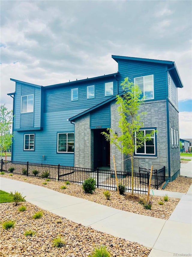 23981 E 40th Ave, Aurora, CO 80019 - contemporary house featuring a fenced front yard