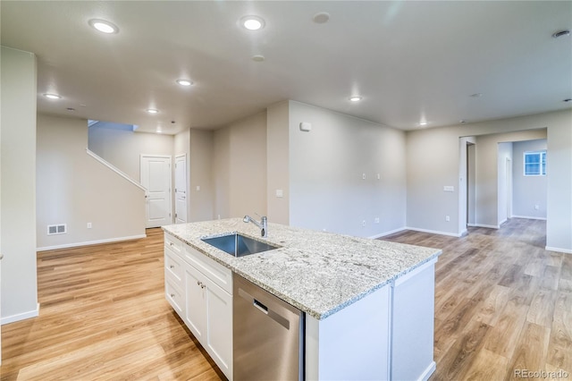 23981 E 40th Ave, Aurora, CO 80019 - kitchen with dishwasher, light wood-style floors, white cabinets, a kitchen island with sink, and recessed lighting