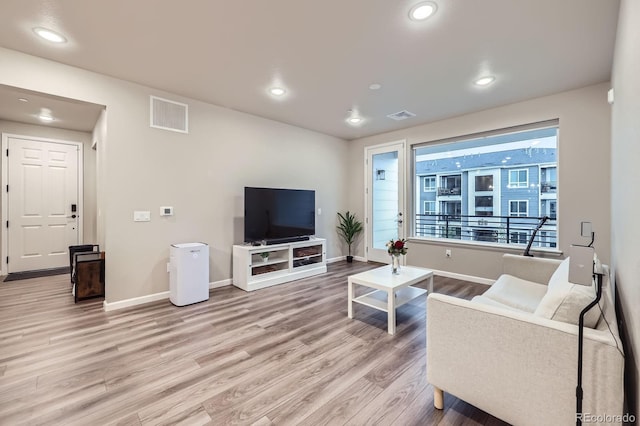 6153 N Ceylon St Unit 2-202, Denver, CO 80249 - living room with light wood-type flooring and recessed lighting
