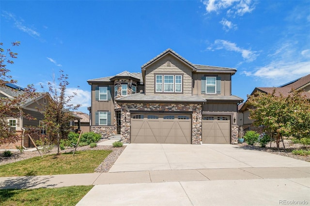7720 S Queensburg Way, Aurora, CO 80016 - craftsman house with an attached garage, stone siding, and board and batten siding