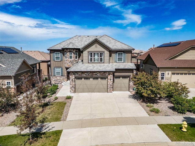 7720 S Queensburg Way, Aurora, CO 80016 - view of front facade with stone siding, an attached garage, driveway, and board and batten siding