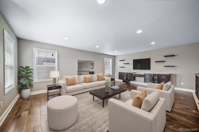 7720 S Queensburg Way, Aurora, CO 80016 - living area featuring wood finished floors, baseboards, and recessed lighting