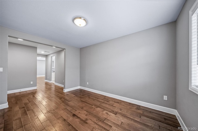7720 S Queensburg Way, Aurora, CO 80016 - empty room with dark wood finished floors and baseboards