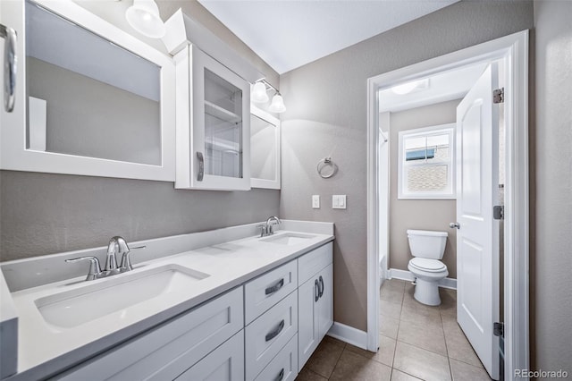 7720 S Queensburg Way, Aurora, CO 80016 - bathroom featuring double vanity, tile patterned floors, toilet, a shower with shower curtain, and baseboards