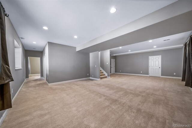 7720 S Queensburg Way, Aurora, CO 80016 - finished basement with light carpet, baseboards, stairs, and recessed lighting